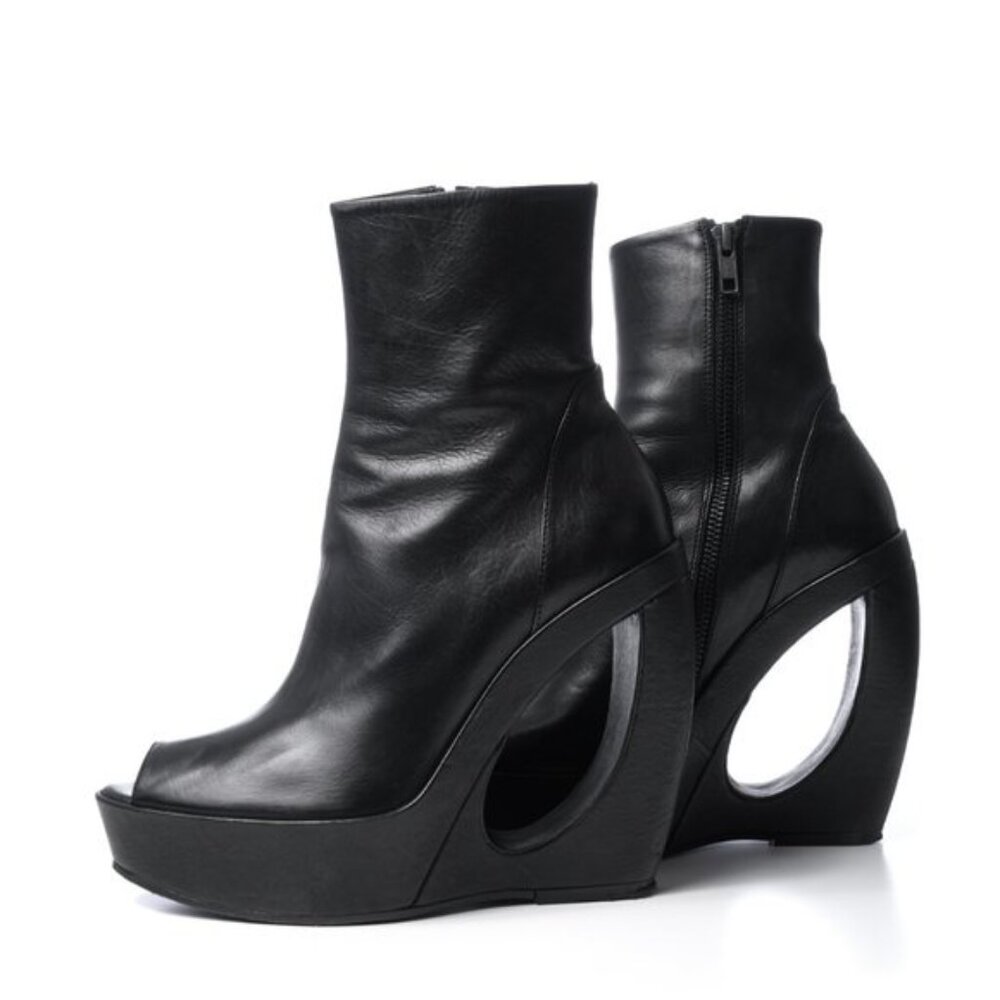 Ann Demeulemeester black boots with cut-out curved heel